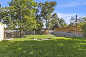 View of fenced backyard