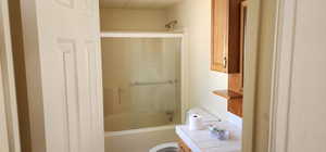 Bathroom with vanity and tub / shower combination