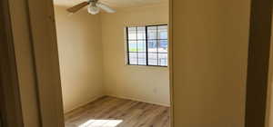 Spare room with light wood-style flooring and ceiling fan