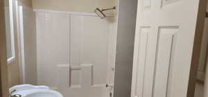 Full bath featuring bathing tub / shower combination and a sink