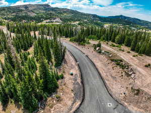 Aerial overview of property's location featuring mountains