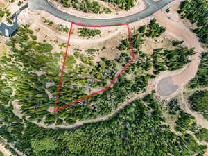 Aerial overview of property's location with property boundaries highlighted and rural landscape