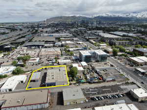 View of urban area featuring a mountain backdrop and property boundaries highlighted