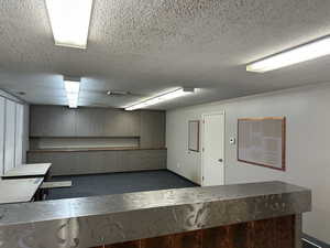 Misc room featuring a textured ceiling