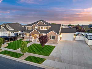 Craftsman inspired home with driveway, a gate, a residential view, and a garage