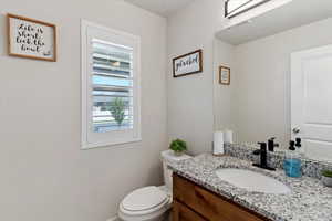 Bathroom featuring toilet and vanity