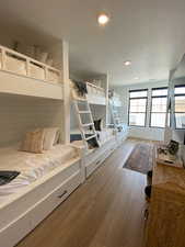 Bedroom featuring wood finished floors, recessed lighting, and a textured ceiling