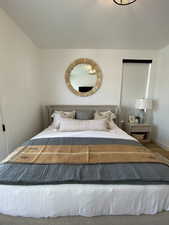 Bedroom featuring wood finished floors and baseboards