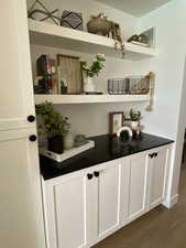Bar area with dark wood finished floors