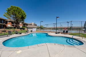 Community pool featuring a patio