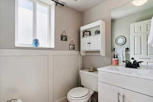 Bathroom featuring toilet and vanity