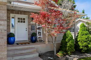 View of exterior entry with stone siding
