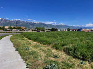 View of mountain backdrop with rural landscape