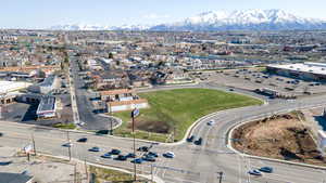 Aerial view of property's location featuring a mountainous background