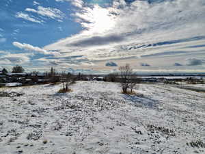 View of yard covered in snow