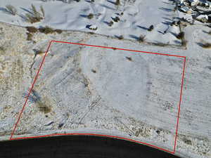 Aerial view of property and surrounding area featuring property boundaries highlighted