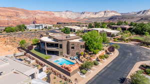 Aerial perspective of suburban area with a mountainous background