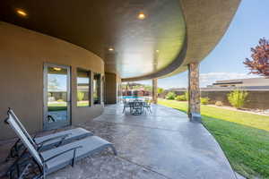 Fenced backyard with a patio area and outdoor dining space