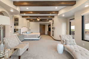 Bedroom with beam ceiling, light carpet, and recessed lighting