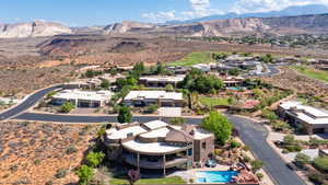 Aerial perspective of suburban area with a mountainous background