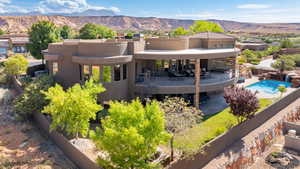 Back of property with a mountain view and stucco siding