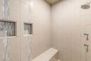 Bathroom featuring tiled shower