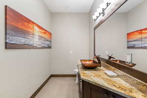Bathroom with vanity and tile patterned floors