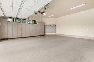 Garage featuring a garage door opener
