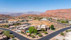 Aerial perspective of suburban area with a mountainous background