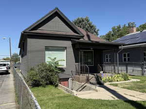View of front of house featuring a porch and roof with shingles