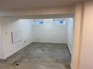 Basement featuring baseboards