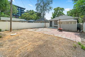 Fenced backyard featuring a patio