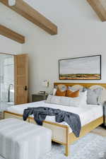 Bedroom with a wooden ceiling with exposed beams and wood finished floors