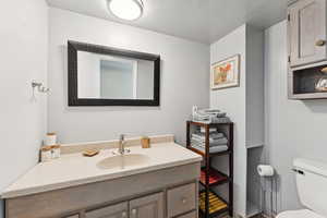 Bathroom with vanity and toilet