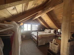 Bedroom featuring wood ceiling