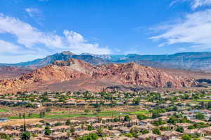 Mountain view with nearby suburban area and a golf course