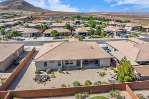 Aerial perspective of suburban area with a mountainous background