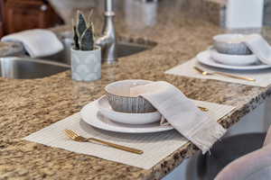 Kitchen view of decorative backsplash and stone countertops