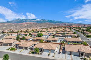 Aerial perspective of suburban area with a mountain backdrop