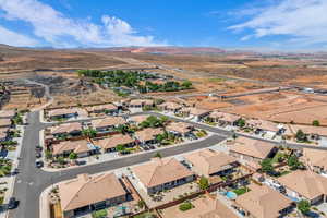 Aerial view of sparsely populated area with a mountainous background
