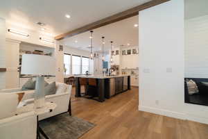 Living room featuring light wood-type flooring and recessed lighting