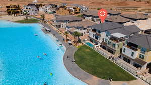 Aerial view of residential area featuring a pool area