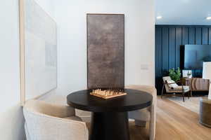 Dining space featuring wood finished floors and recessed lighting