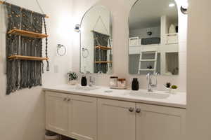 Bathroom featuring double vanity