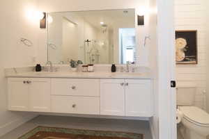 Bathroom with double vanity and a shower