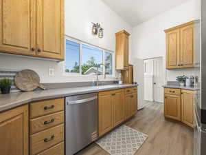 Kitchen featuring stainless steel appliances and light wood-type flooring