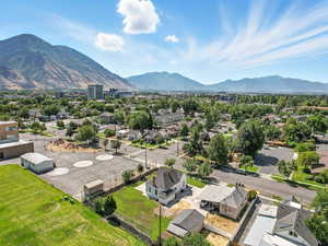 Aerial perspective of suburban area featuring a mountainous background