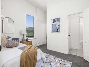 Bedroom with carpet, tile patterned flooring, and a mountain view