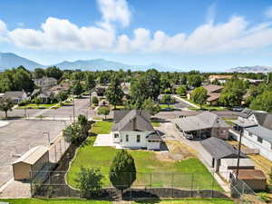 Aerial view of residential area featuring a mountain backdrop
