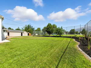 View of yard with an outbuilding